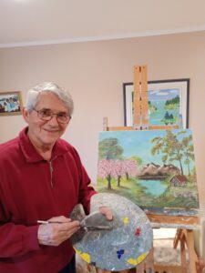 Artist painting in studio